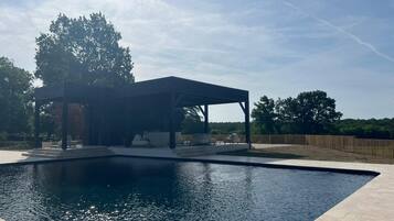 Seasonal outdoor pool, pool loungers
