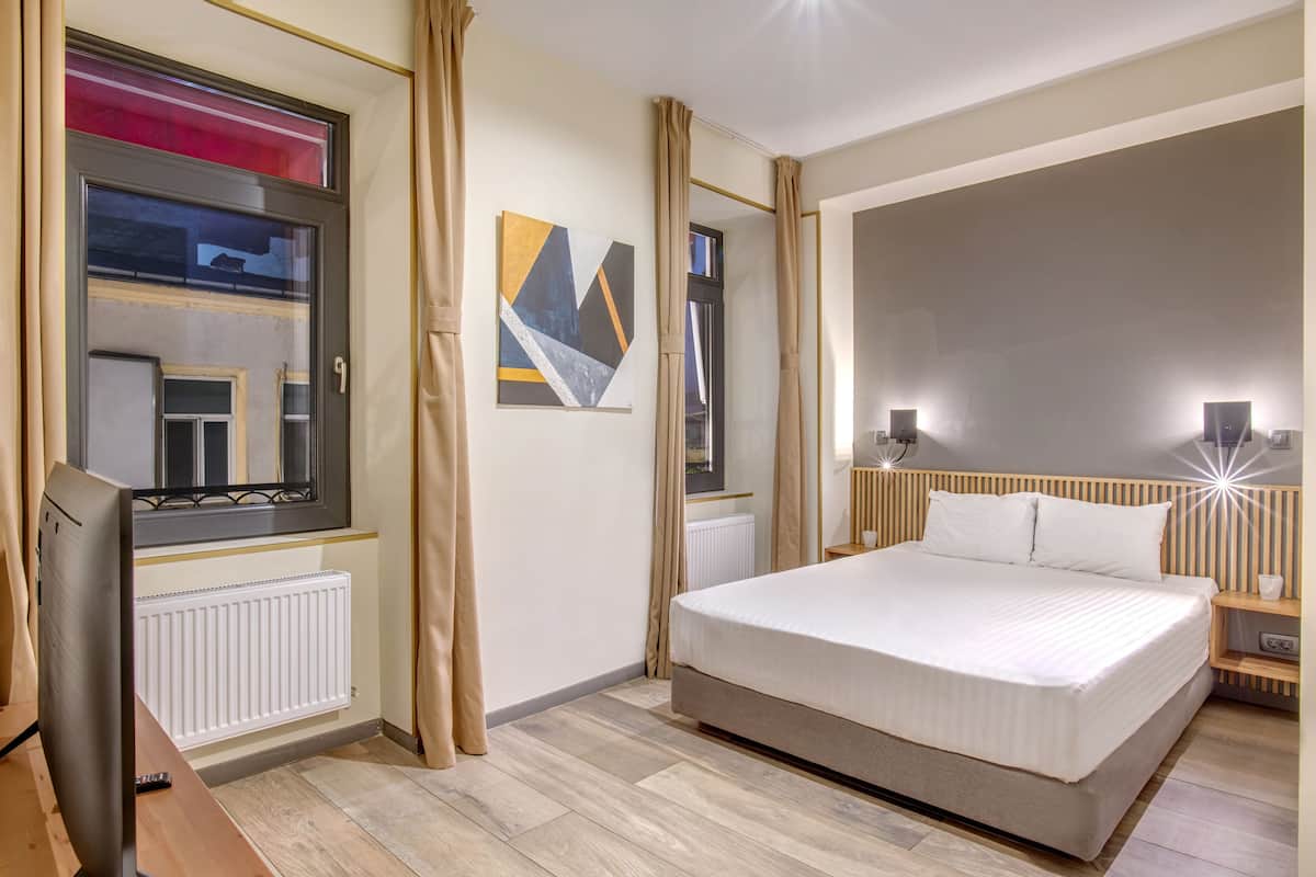 Suite superior | 1 habitación, cortinas blackout y tabla de planchar con plancha