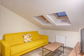 Standard Suite | Living area | 100-inch LCD TV with cable channels, TV - Hotel Forty One Bucharest (Bucharest)