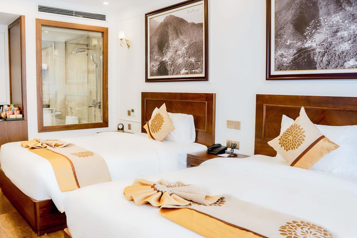 Habitación Deluxe | Ropa de cama de alta calidad y camas con efecto memoria