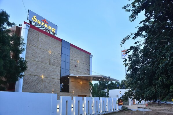 A building with a sign reading "Sarang" and a modern architectural design.