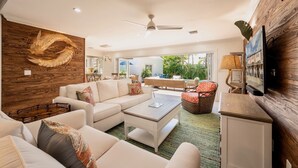 A spacious living room with a white sofa set, a coffee table, and a dining area with a table and chairs. - **SOUTHERNMOST BLISS @ OLD TOWN** Home & Pool + Last Key White Glove Service... (Key West)