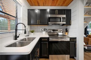 Oven, stovetop, dishwasher, cookware/dishes/utensils - “Elk” High LUXE 1 Bedroom A-Frame, The Alps of Hochatown (Broken Bow)