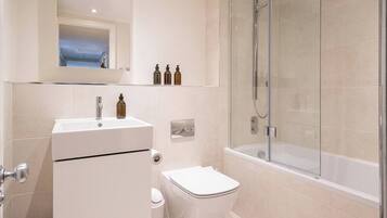 Bathtub, hair dryer, towels