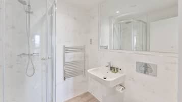 Bathtub, hair dryer, towels