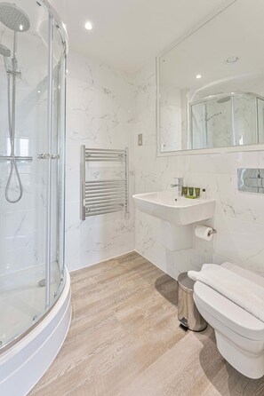 Bathtub, hair dryer, towels