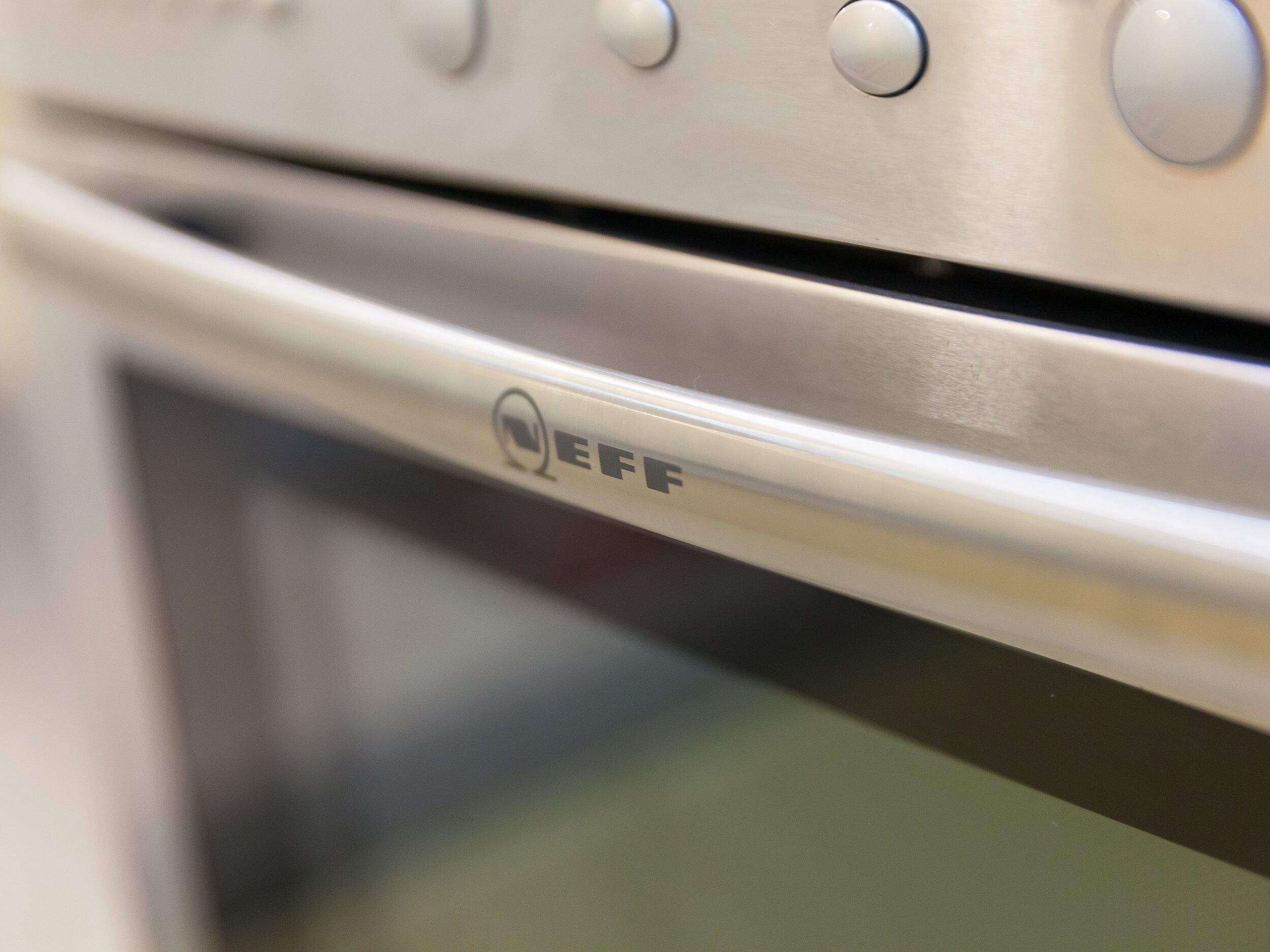A close-up of an oven control panel with the brand "EFF" visible.