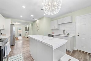 Fridge, microwave, oven, stovetop - Coastal Island Home with Pool & Game Room (Galveston)