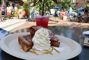 Guests can enjoy a delicious breakfast at this outdoor dining area.