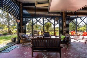 Outdoor dining - Secluded Marsh Front Home-Salt Water Pond-Short walk to the beach access! (Folly Beach)