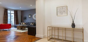 Relax in this stylish living room with a sofa, armchair, and coffee table.