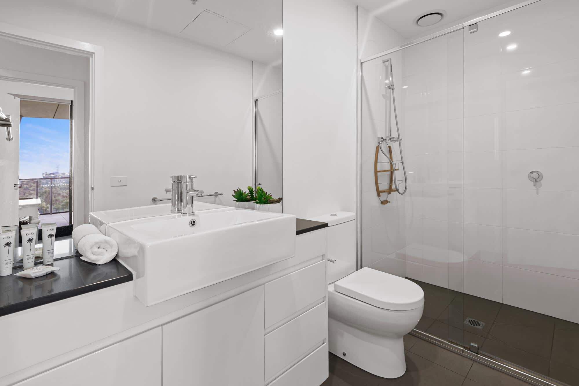 Shower, hair dryer, towels, shampoo