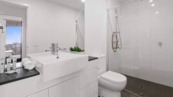 Shower, hair dryer, towels, shampoo