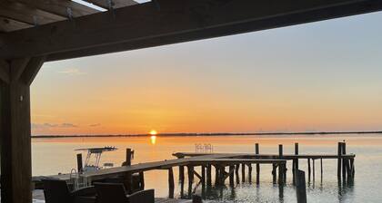Unique, authentic, exquisite waterfront cottage with a dock.