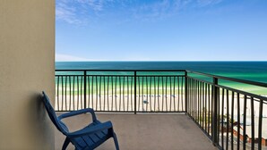 A balcony with a view of a beach and ocean. - Origin 1136/1138 - Two Bedroom Lock Out - Sweeping Gulf Views (Panama City Beach)