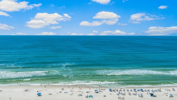 A beach with clear blue water and a sandy shore. - Origin 1333/1335 - Three Bedroom Gulf View Connector Unit- Stunning Gulf Views (Panama City Beach)