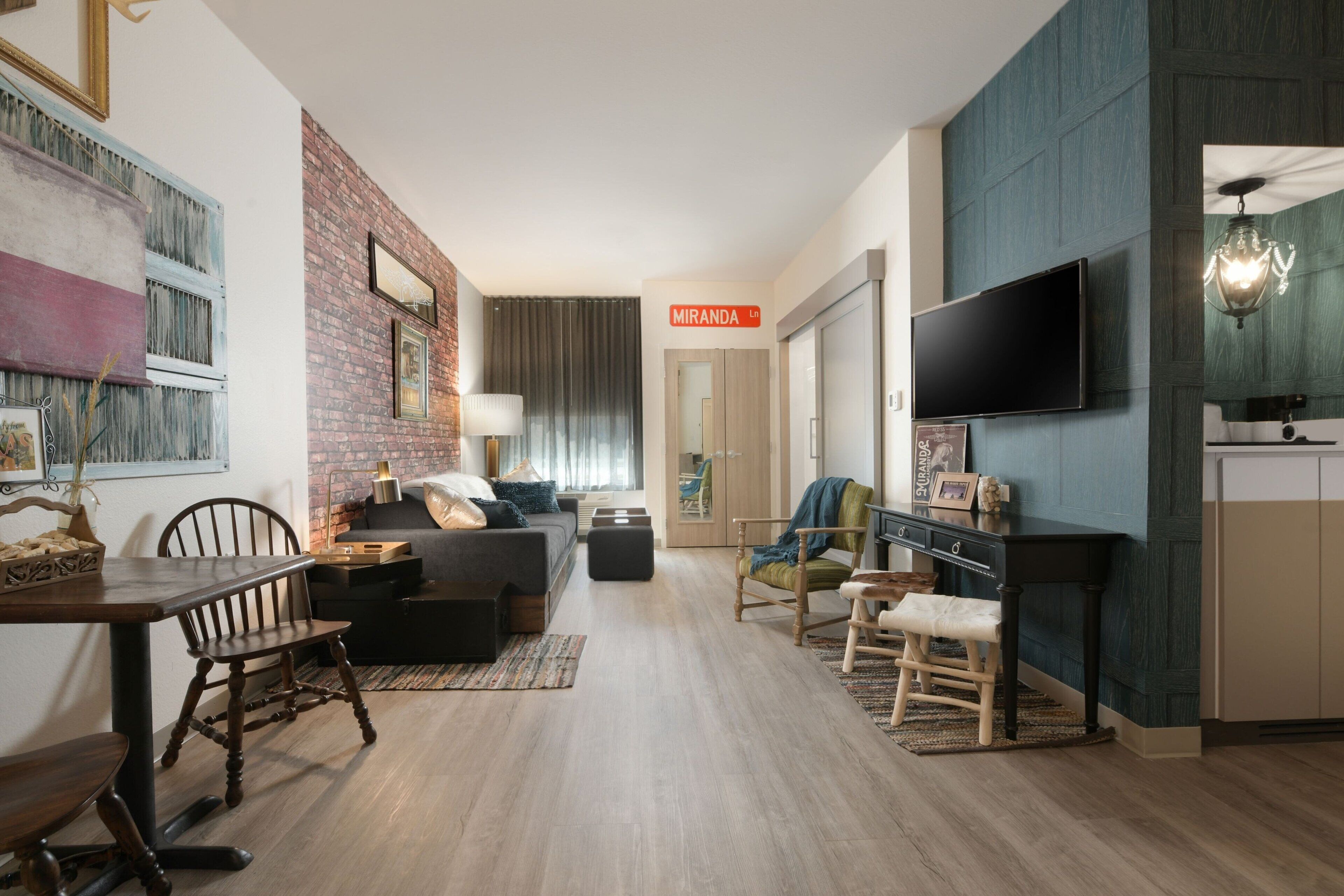 desk, laptop workspace, blackout curtains, iron/ironing board