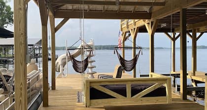 Two-story boathouse, golf cart, hot tub, kayaks, paddle boards, fishing lights!