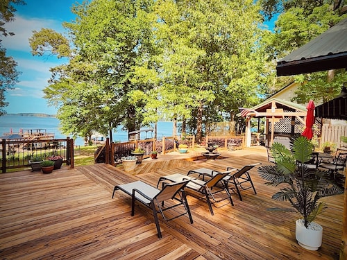 Two-story boathouse, golf cart, hot tub, kayaks, paddle boards, fishing lights!