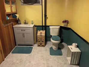 Bathtub, towels, soap, toilet paper