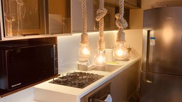 Deluxe Apartment | Private kitchen | Full-sized fridge, microwave, oven, blender