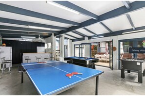 Enjoy a game of ping pong or foosball in this vibrant indoor recreational area.