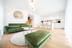 Design Apartment | Living area | 38-inch Smart TV with cable channels, TV