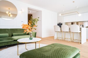 Design Apartment | Living area | 38-inch Smart TV with cable channels, TV