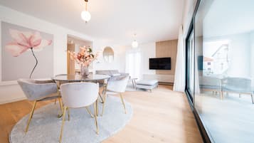 Design Apartment | Living area | 38-inch Smart TV with cable channels, TV