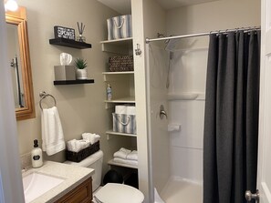 Combined shower/tub, hair dryer, towels, soap