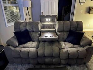 Relax in comfort on this plush sofa, perfect for unwinding in an indoor space.