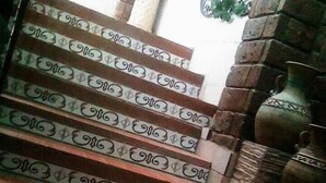 A staircase with patterned steps leading to a landing. - HOTEL TERRANOVA TAMPICO (Tampico)