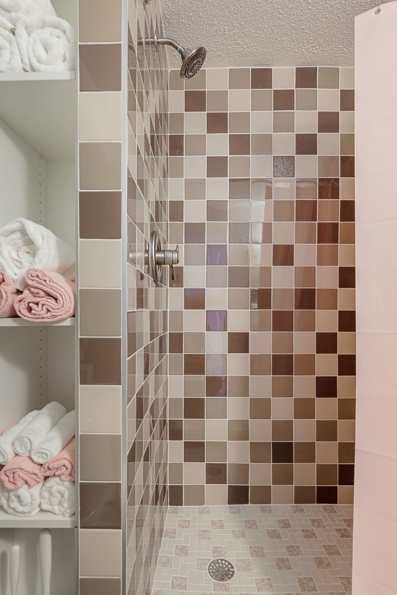 Shower, hair dryer, towels, shampoo