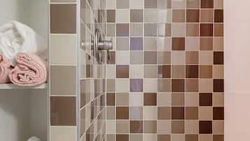 Shower, hair dryer, towels, shampoo