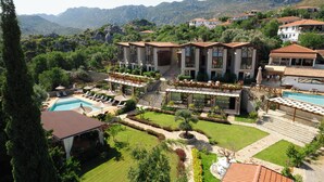 A resort with a swimming pool, sun loungers, and a well-maintained garden. - Boho Garden Selimiye (Marmaris)