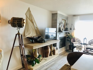 Smart TV, fireplace, books