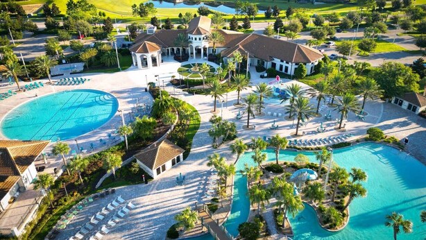 A resort with multiple swimming pools, a golf course, and a variety of villas and guest accommodations.