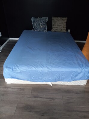 Restful retreat with a large bed and stylish headboard.