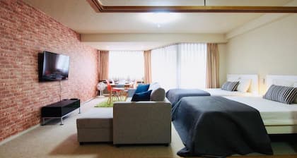 Ski-in, ski-out luxury resort condominium with hot spring, pool and karaoke