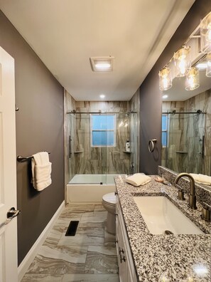 Bathtub, hair dryer, towels, soap