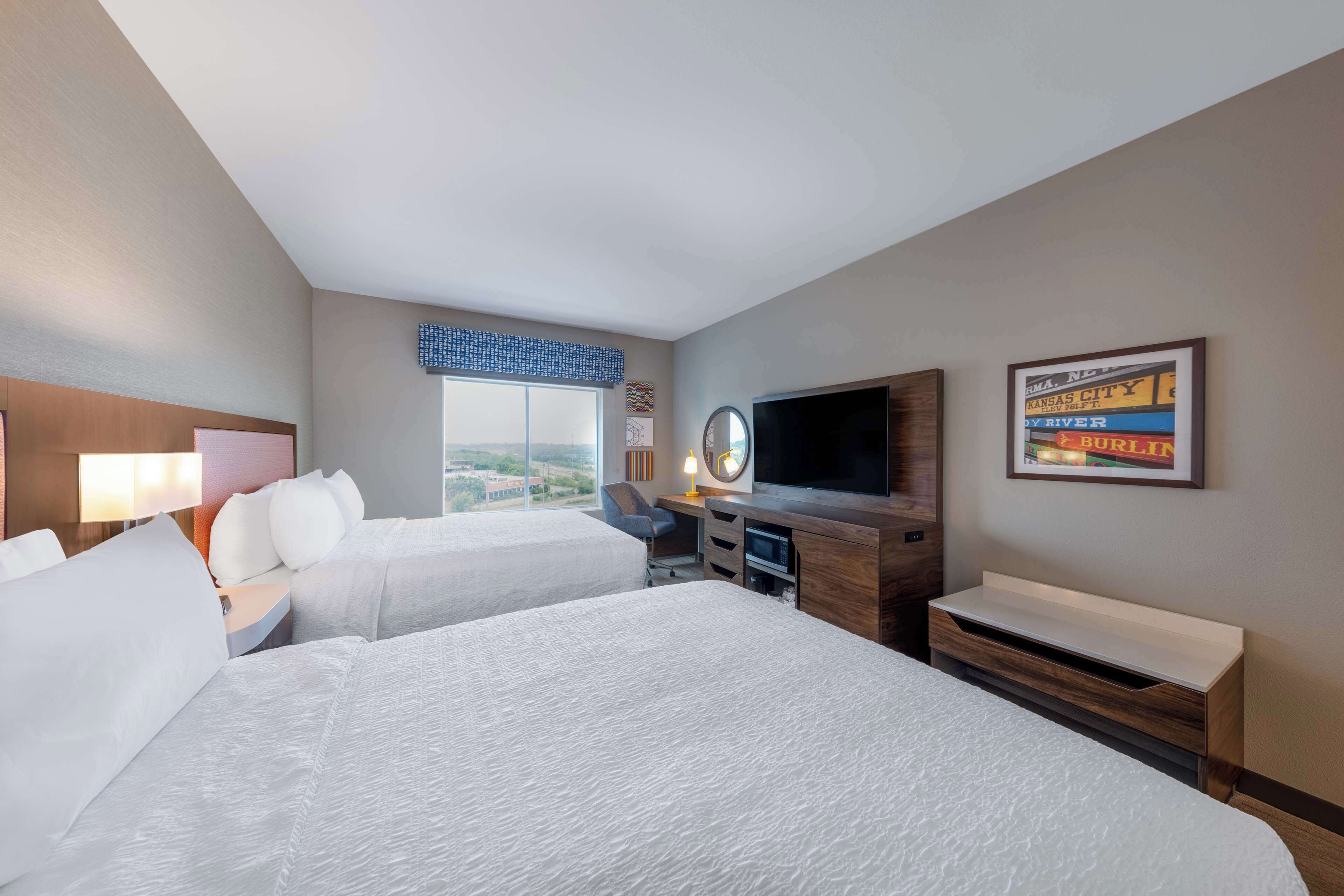 room, 2 queen beds, refrigerator | desk, blackout curtains, iron/ironing board, free cots/infant beds