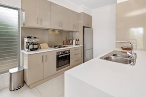 Coffee/tea maker, fridge, microwave, oven