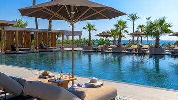 Outdoor pool, pool umbrellas, sun loungers