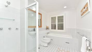 Bathtub, eco-friendly toiletries, hair dryer, soap