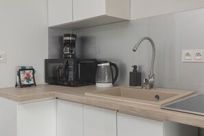 Fridge, microwave, stovetop, coffee/tea maker