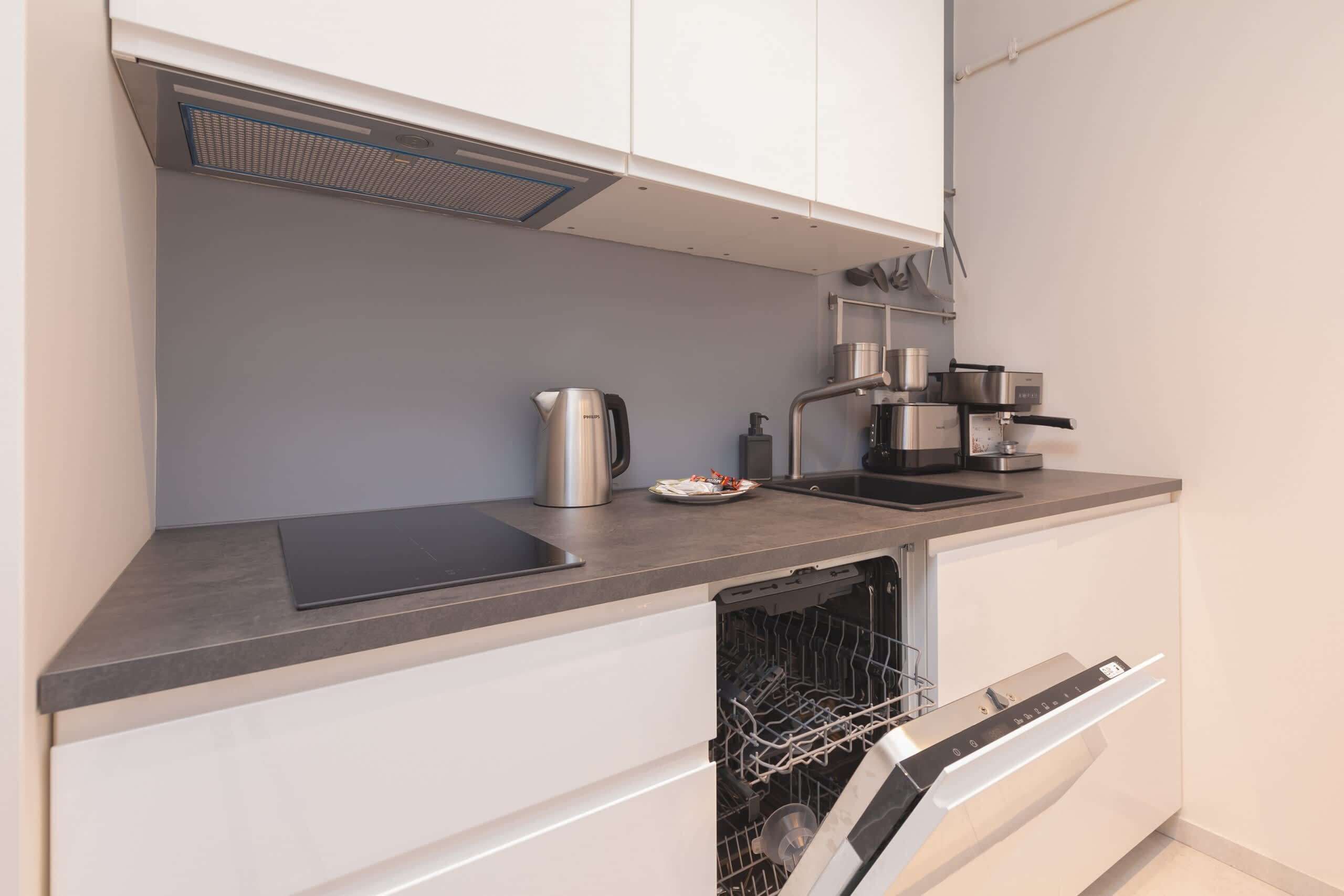 Fridge, stovetop, dishwasher, coffee/tea maker