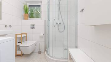 Shower, hair dryer, towels, shampoo