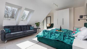 1 bedroom, desk, iron/ironing board, travel crib