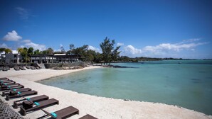 A beachside hotel with sun loungers and a pool. - Sea Diamond Boutique Hotel & Spa by Sea Resorts (Calodyne)