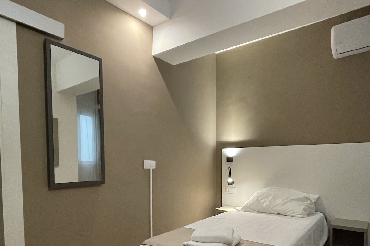 Economy Single Room | Down comforters, in-room safe, blackout drapes, free WiFi